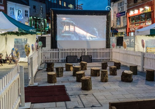 Christmas themed outdoor cinema event hire Northern Ireland, Belfast, Derry, Londonderry, Craigavon, Newtownabbey, Castlereagh, Lisburn, Ballymena, Lurgan, Portadown, Newtownards, Newry, Carrickfergus, Antrim, Coleraine, Omagh, Larne, Bandbridge, Armagh, Dungannon, Enniskillen, Cookstown, Limavady, Downpatrick, Ballymoney,  Magherafelt, Portrush, Ballycastle, Maghera